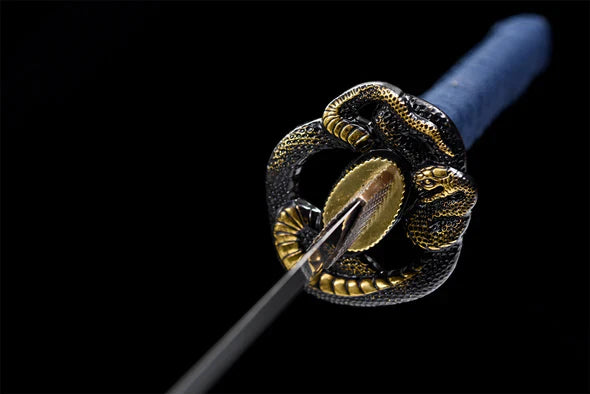 Tsuba-Serpent-Prehistorique